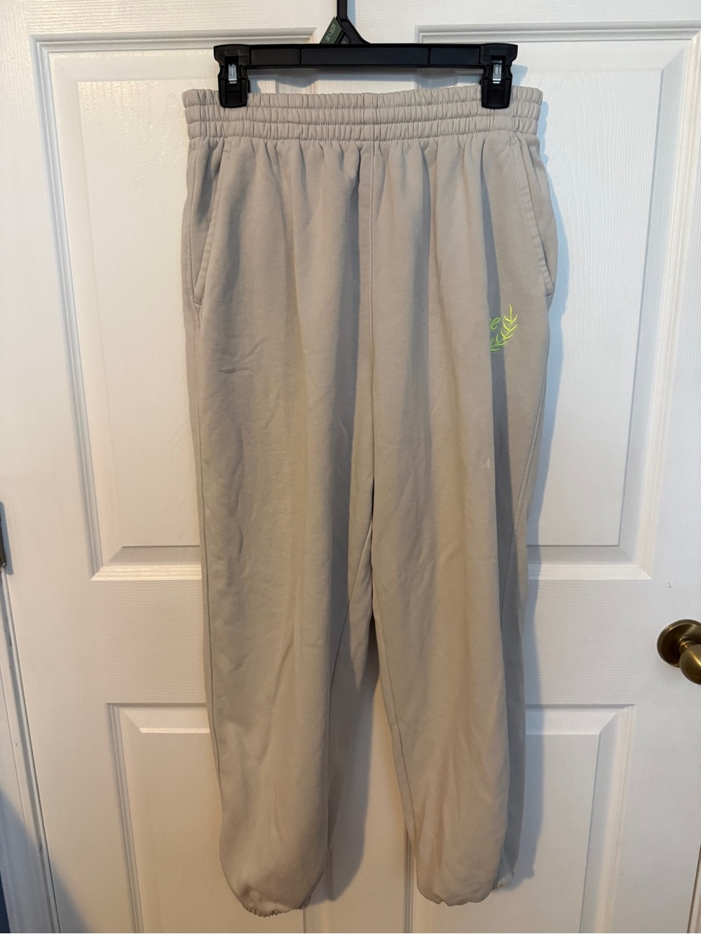 Nike Kids Beige Sweatpants with Neon Green Logo